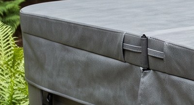 Close-up of a spa cover corner, with the skirt wrapping around it in a single piece and no seam at the corner.