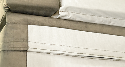 Close-up of a spa cover corner showing the reinforced center hinge.