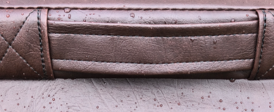 Close-up of a premium heavy-duty handle stitched into the seam of a hot tub cover.