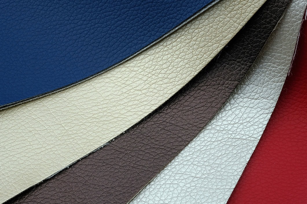 Textured vinyl material in multiple colors, used for durable and weather-resistant spa covers.